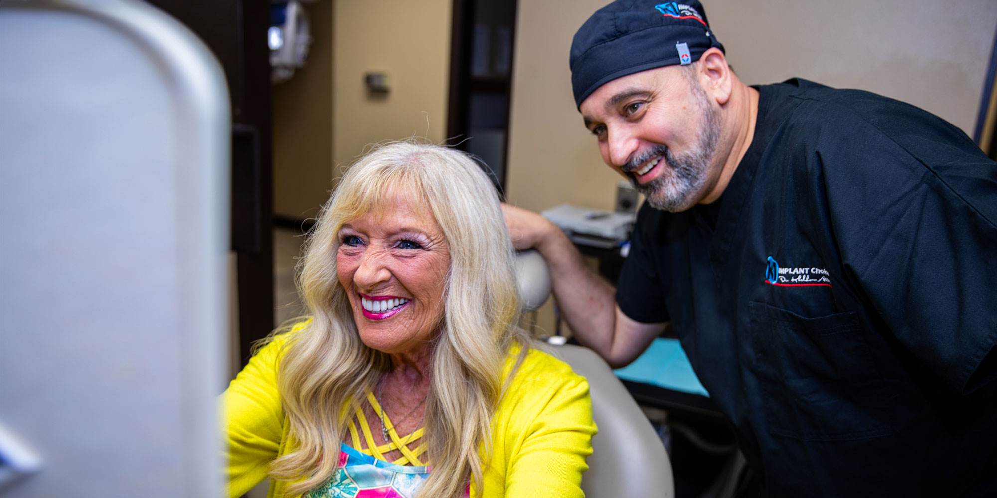 dr attar with carol after full mouth implants